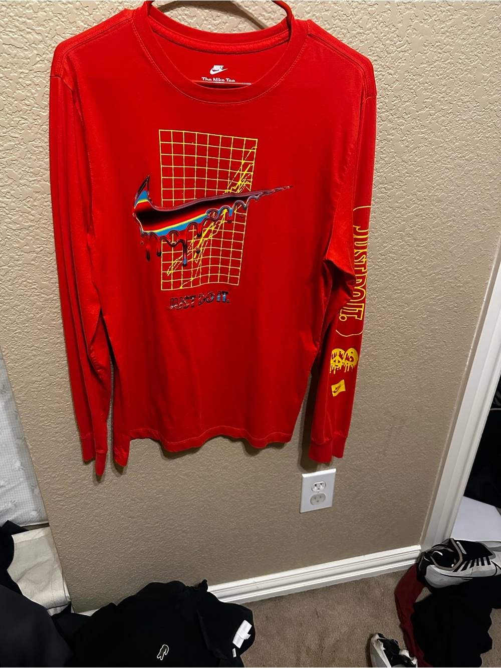 Nike Red Long-Sleeve Graphic Tee with Multicolor Swoosh and Yellow Grid